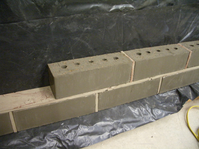 Clay slabs are laid between to simulate mortar joints