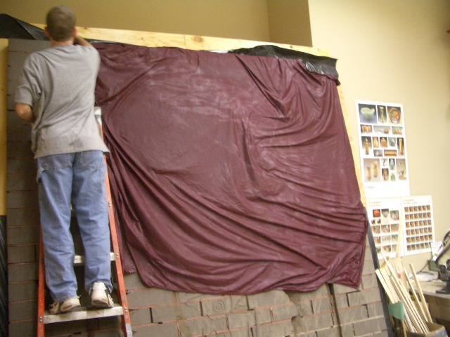 Bricks are covered with wet sheets